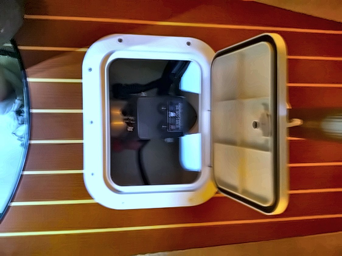 Thruster motor accessed through a service hatch