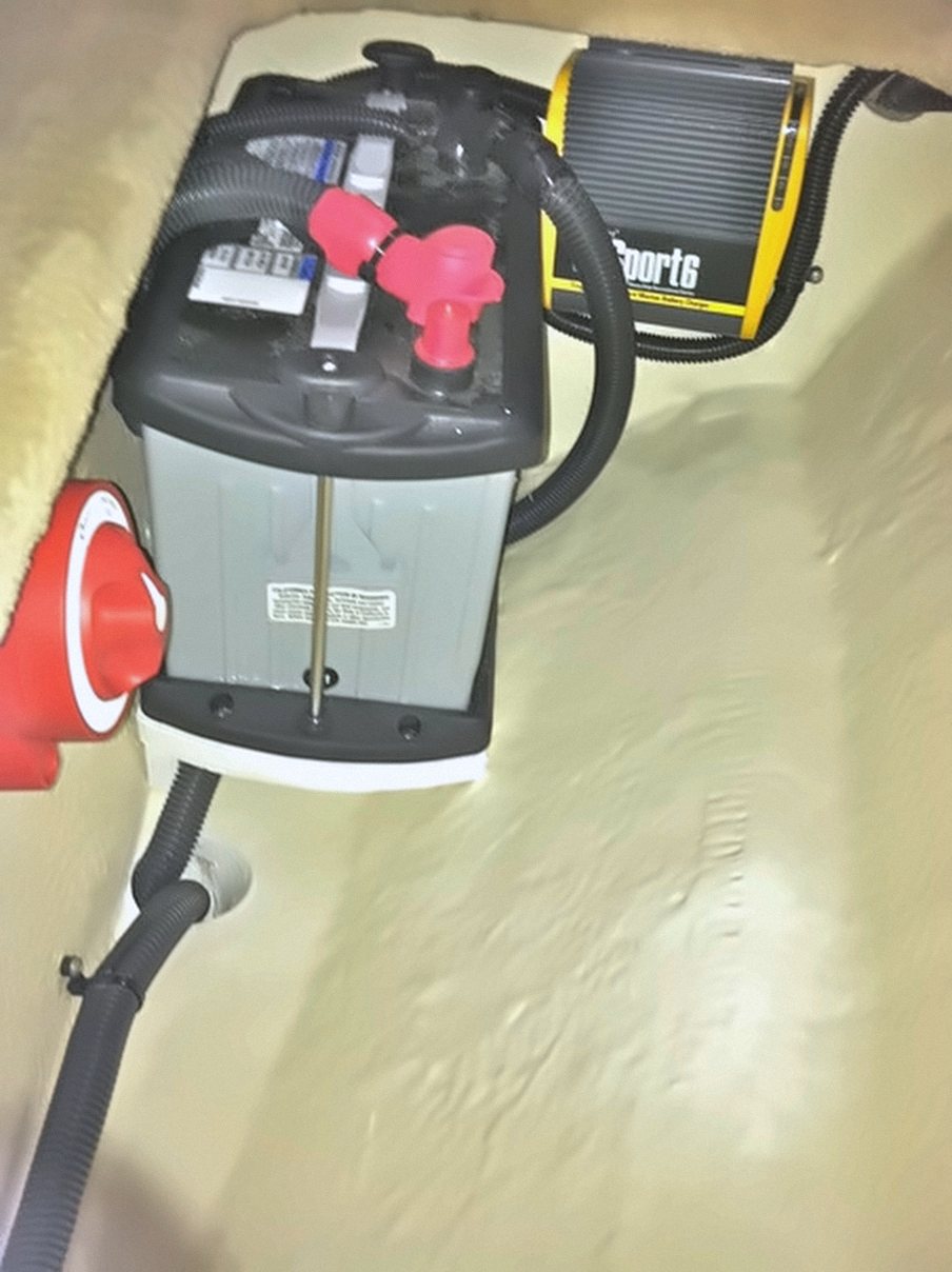 Dedicated thruster battery, battery switch and onboard charger mounted in the forward compartment